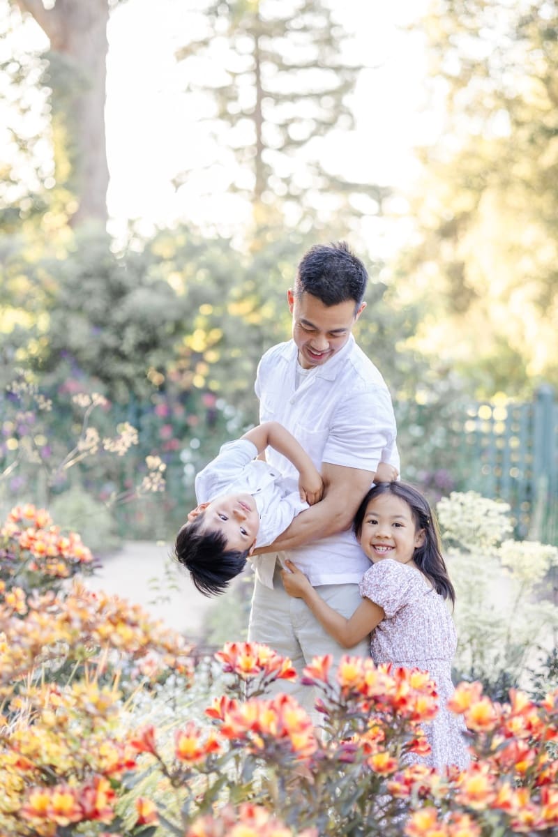 dad with his toddler son and daughter captured in a playful sweet moment in bay area photoshoot
